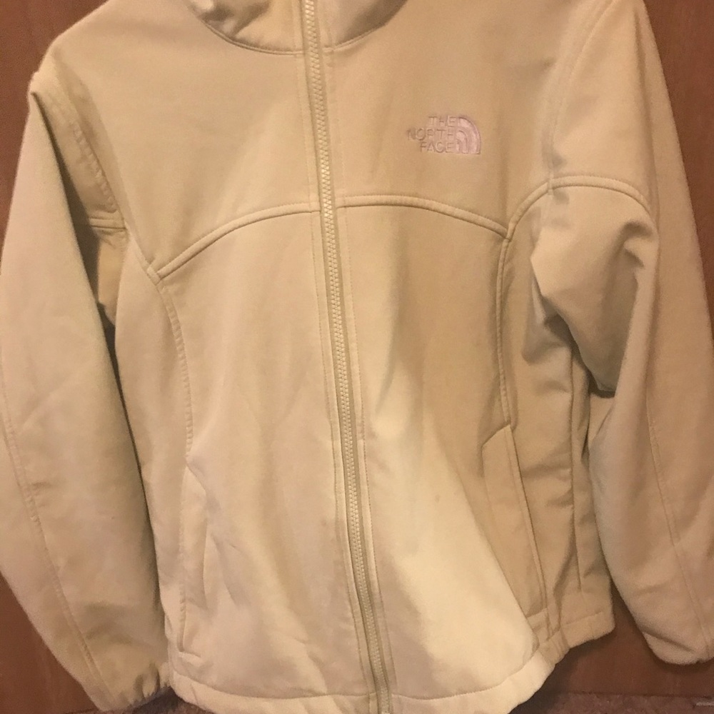 Green north face zip up.